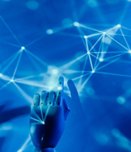 Robotic hand connected to digital network lines representing artificial intelligence and advanced technology in 2026